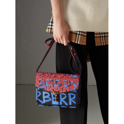 Shop Burberry Small Graffiti Print Leather Crossbody Bag In Black