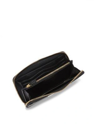 Shop Anya Hindmarch Eyes Large Leather Zip-around Wallet In Black