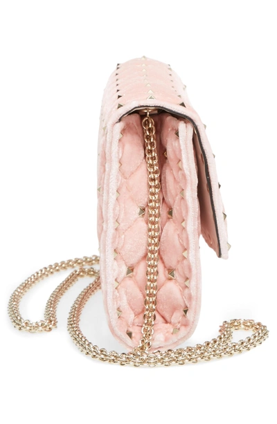 Shop Valentino Rockstud Velvet Clutch In Pink