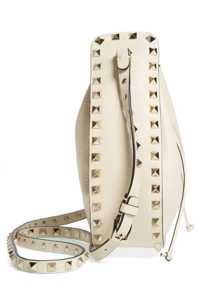 Shop Valentino Rockstud Leather Bucket Bag - Ivory In Light Ivory