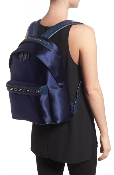 Shop Stella Mccartney Logo Embossed Satin Backpack - Blue In Navy