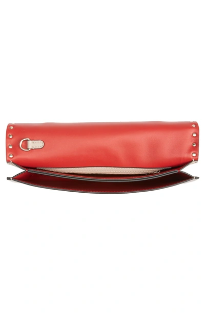 Shop Valentino Rockstud Calfskin Leather Clutch - Pink In Poudre