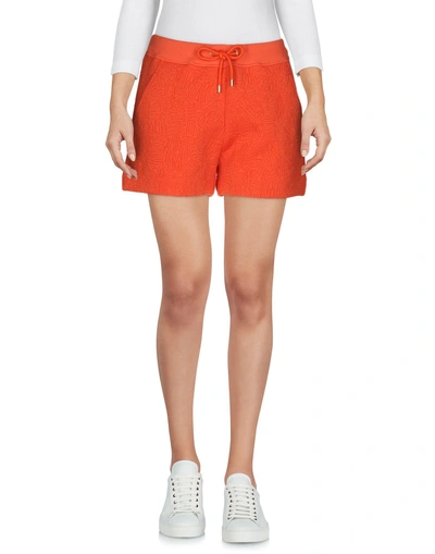 Shop Moschino Shorts In Orange