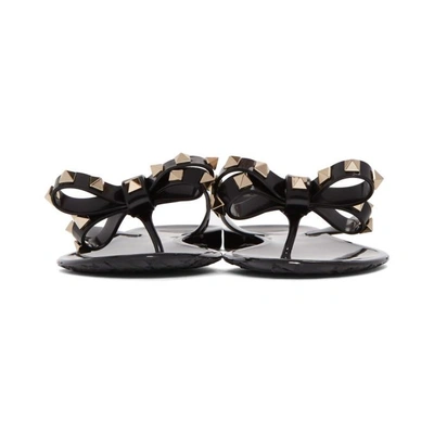 Shop Valentino Black  Garavani Rockstud Jelly Bow Sandals In 0no Black