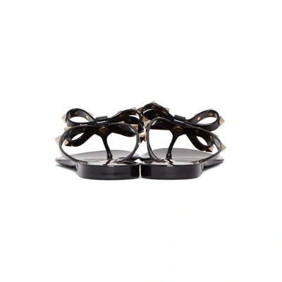 Shop Valentino Black  Garavani Rockstud Jelly Bow Sandals In 0no Black