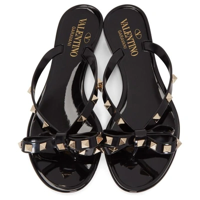 Shop Valentino Black  Garavani Rockstud Jelly Bow Sandals In 0no Black