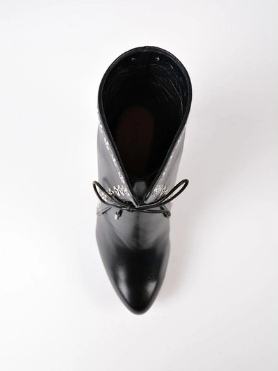 Shop Alexander Mcqueen Horn Heel Ankle Boots In Black