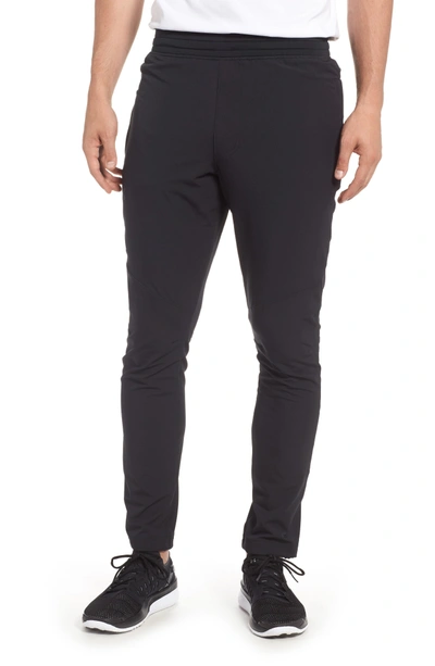 Shop Under Armour Tapered Slim Fit Woven Training Pants In Black