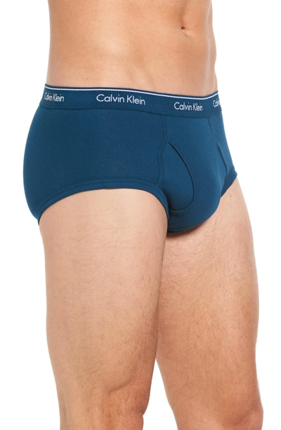 Shop Calvin Klein 4-pack Cotton Briefs In Orange/ Blue Multi/ Black