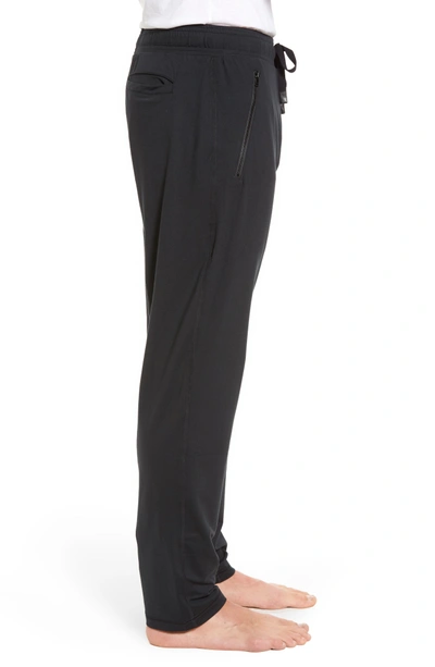 Shop Alo Yoga Renew Relaxed Slim Fit Lounge Pants In Black