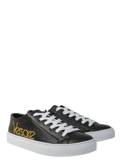 Shop Versace Leather Sneakers In Nero