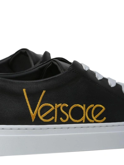 Shop Versace Leather Sneakers In Nero