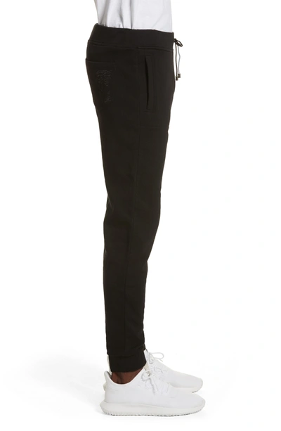 Shop Versace Medusa Embroidered Jogger Pants In Black