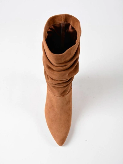Shop Stuart Weitzman Slouchy Pointed Boots In Saddle