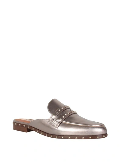 Shop Valentino Laminated Rockstud Loafers In Oro
