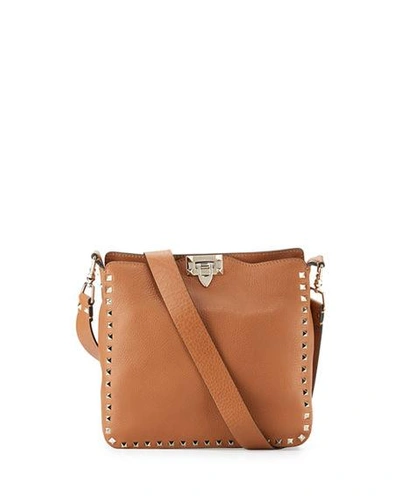 Shop Valentino Rockstud Small Flip-lock Hobo Bag In Cognac