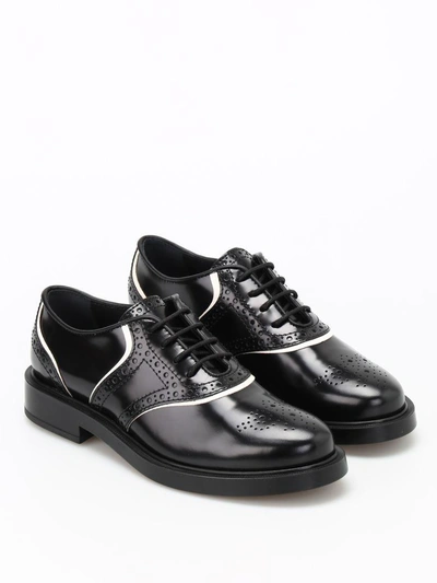 Shop Tod's Laced Shoes In Black+yogurt