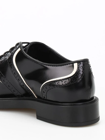Shop Tod's Laced Shoes In Black+yogurt