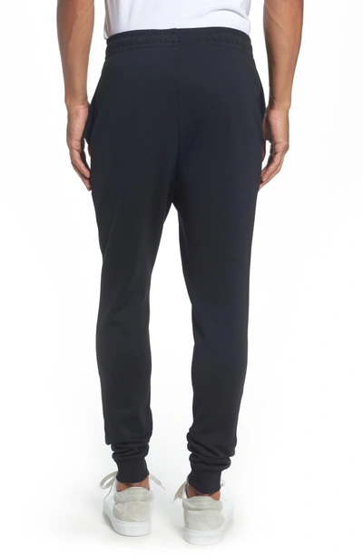 Shop Lacoste Tapered Jogger Pants In Black