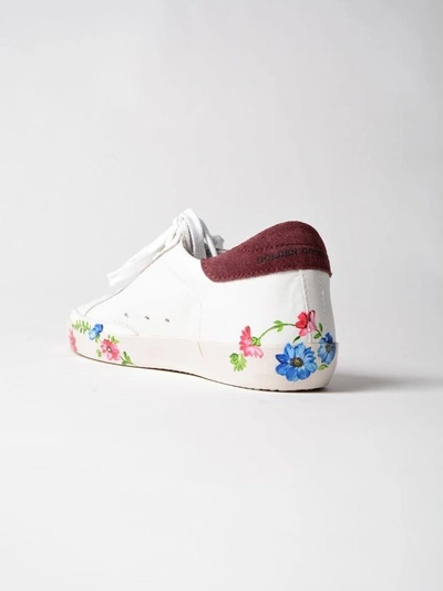 Shop Golden Goose Baux Hand Painted Sole Sneakers In White