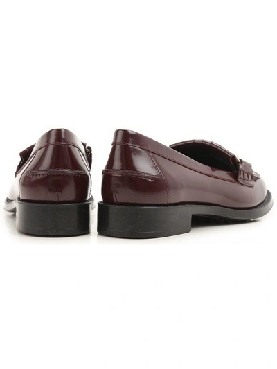 Shop Tod's Double T Fringed Leather Loafers In Must+black