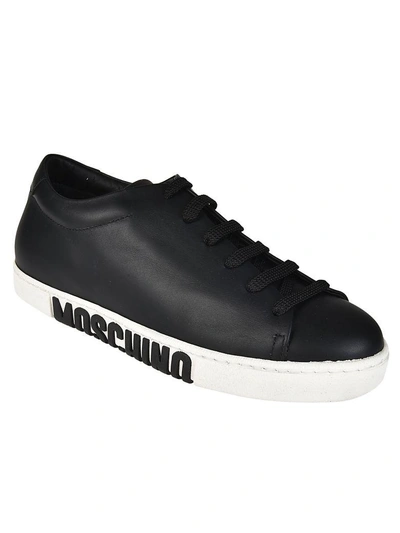 Shop Moschino Logo Embossed Sneakers