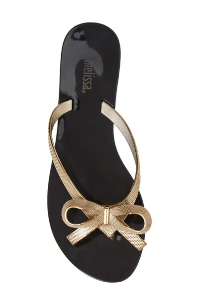 Shop Melissa Harmonic Bow Chrome Ii Sandal In Black/ Gold
