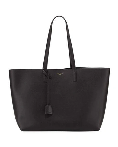 Shop Saint Laurent East West Calfskin Shopping Tote Bag In Black