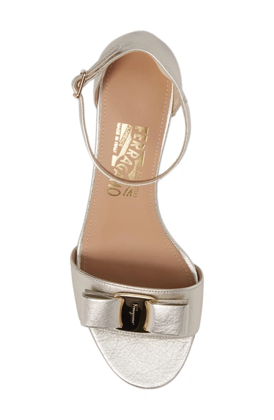 Shop Ferragamo Gavina Block Heel Bow Sandal In Metallic Silver