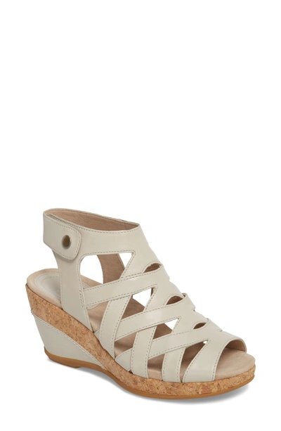 Shop Dansko Cecily Caged Wedge Sandal In Ivory Leather