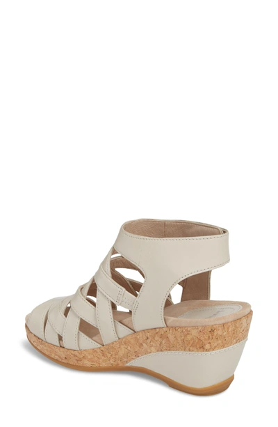 Shop Dansko Cecily Caged Wedge Sandal In Ivory Leather