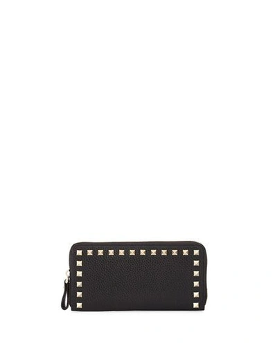 Shop Valentino Rockstud Zip-around Wallet In Black