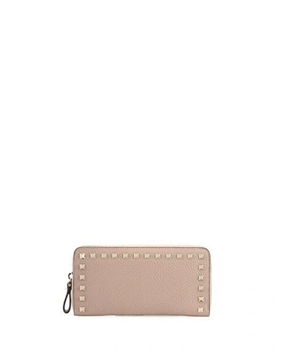 Shop Valentino Rockstud Zip-around Wallet In Light Pink
