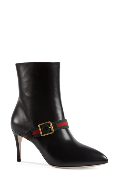 Shop Gucci Sylvie Strap Ankle Boot In Black Leather