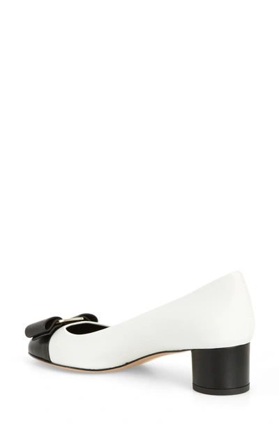 Shop Ferragamo Ivrea Bow Pump In White/ Black