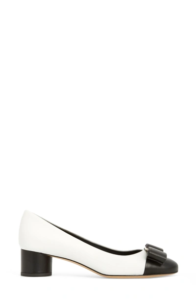 Shop Ferragamo Ivrea Bow Pump In White/ Black