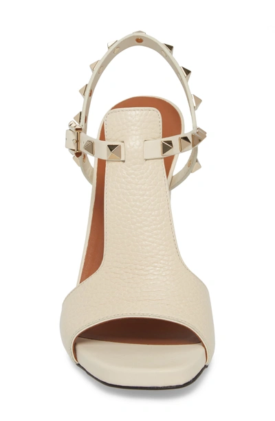 Shop Valentino Rockstud T-strap Sandal In Light Ivory