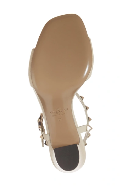 Shop Valentino Rockstud T-strap Sandal In Light Ivory