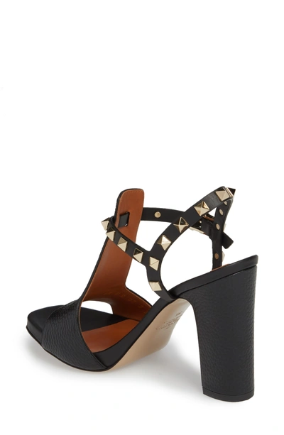 Shop Valentino Rockstud T-strap Sandal In Black Leather