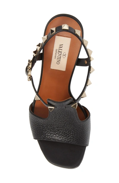 Shop Valentino Rockstud T-strap Sandal In Black Leather