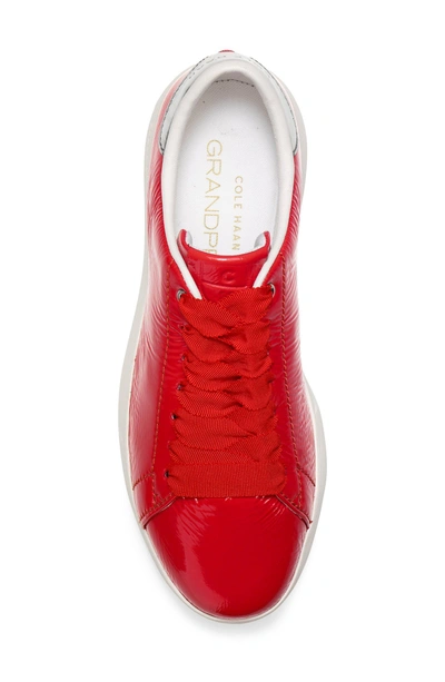 Shop Cole Haan Grandpro Tennis Shoe In Aura Orange Patent