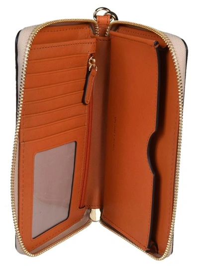 Shop Michael Kors Center Stripe Zip Around Wallet In Natural-orange