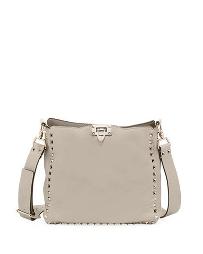 Shop Valentino Rockstud Small Leather Hobo Bag In Beige