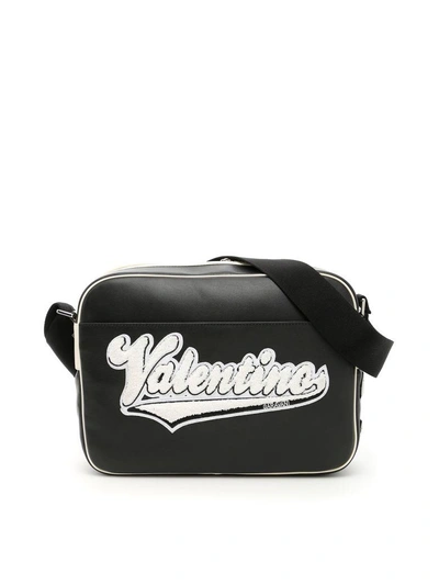 Shop Valentino Leather Messenger Bag With Embroidered Logo In Nero Avorionero