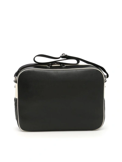 Shop Valentino Leather Messenger Bag With Embroidered Logo In Nero Avorionero