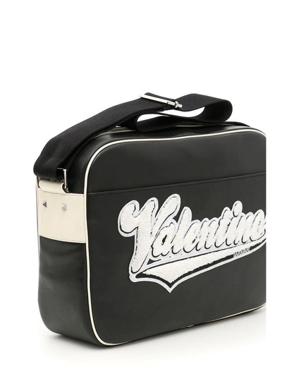 Shop Valentino Leather Messenger Bag With Embroidered Logo In Nero Avorionero