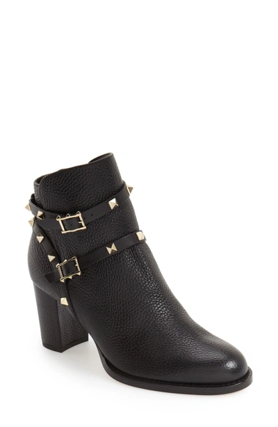 Shop Valentino Rockstud Bootie In Black