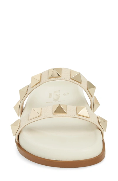 Shop Valentino Rockstud Lock Slide Sandal In Light Ivory