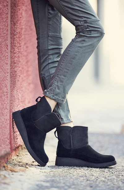 Shop Ugg Kristin - Classic Slim(tm) Water Resistant Mini Boot In Black Suede