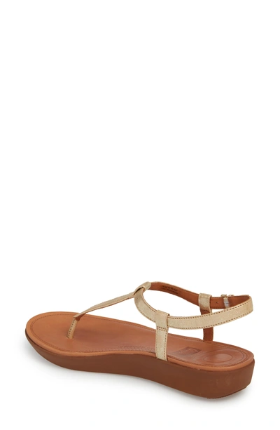 Shop Fitflop Tia Thong Sandal In Pale Gold Leather